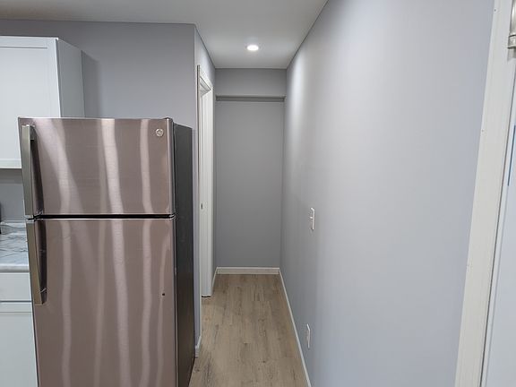 hallway to bathroom and small storage area