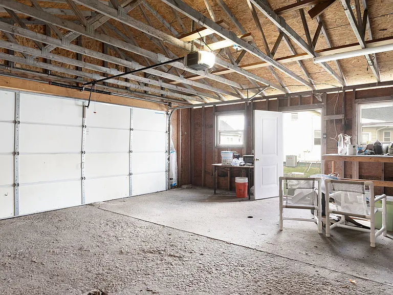 Interior of large garage with door from from Yard
