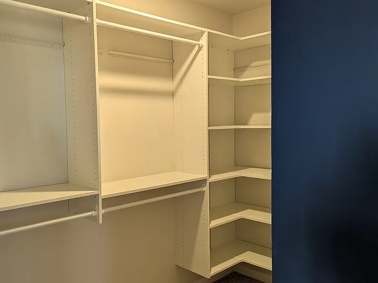 Closet organizer in primary bedroom