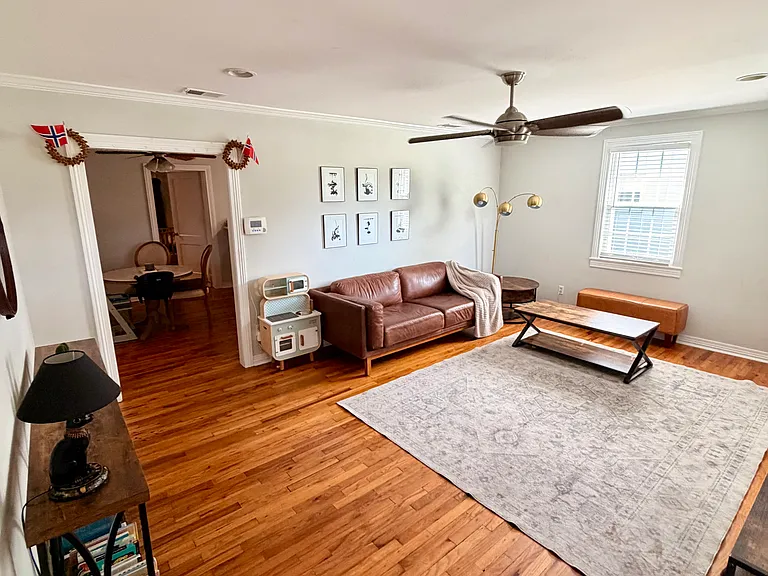 Living room upon entry way with plenty of natural lighting