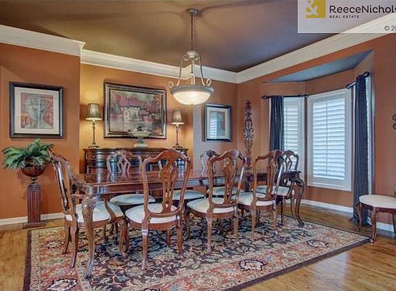 Large dining room w/ plantation shutters