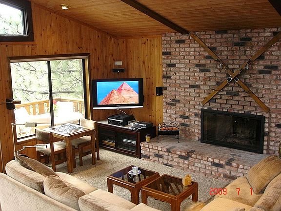 Living Room with HD Flat Screen TV, Surround Sound and Wood-Burning Fireplace