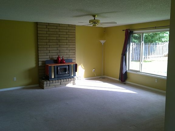 Spacious living area with wood stove