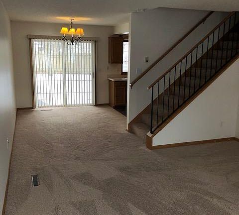Informal dining room (light can be lowered) and a sliding door to a patio and shared backyard.