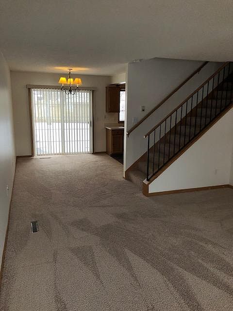 Informal dining room (light can be lowered) and a sliding door to a patio and shared backyard.