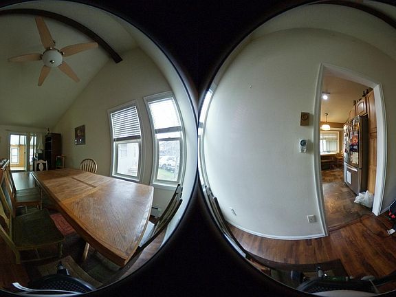 Additional view inside living room looking into enclosed dec