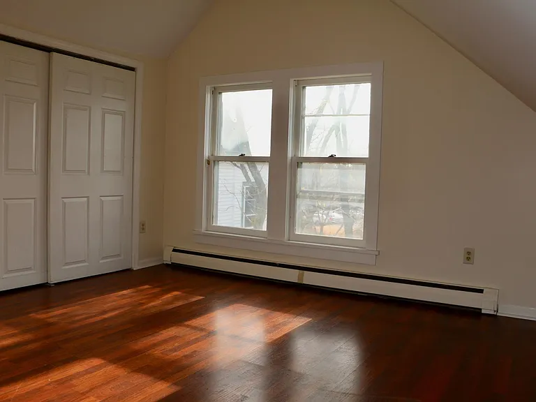 Bedroom with ample spacious walk-in closet and lots of natural light.