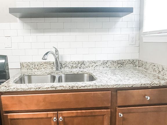 Newly renovated kitchen with granite countertops
