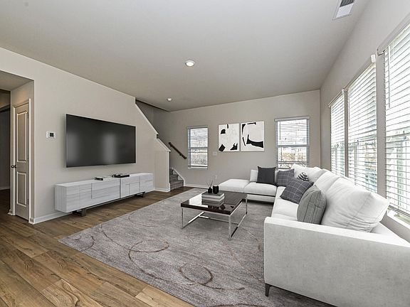 Watch your favorite movie or curl up with a good book in the great room.