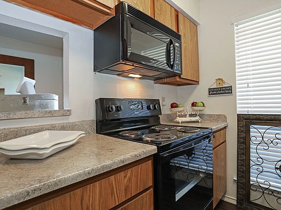 Fully equipped kitchen with ample cabinet space, modern appliances, and functional layout ideal for cooking and entertaining
