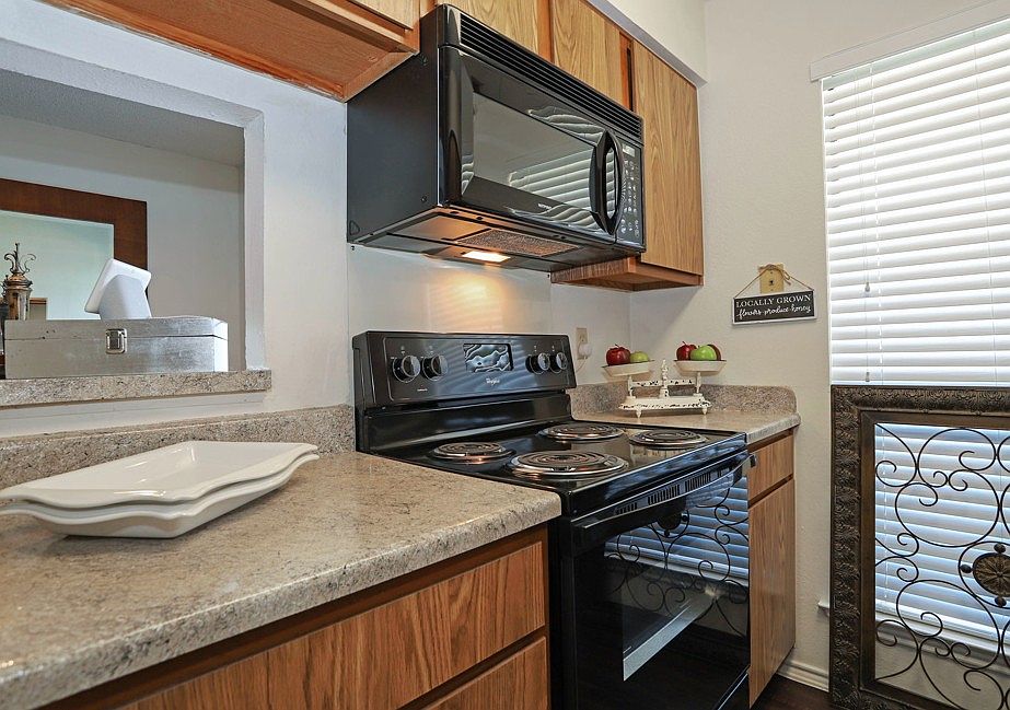Fully equipped kitchen with ample cabinet space, modern appliances, and functional layout ideal for cooking and entertaining