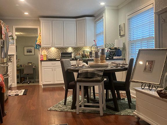 Kitchen and dining area shown with furniture