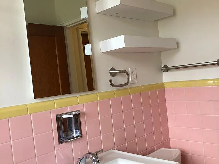 Medicine cabinet and decorative shelves for storage.
