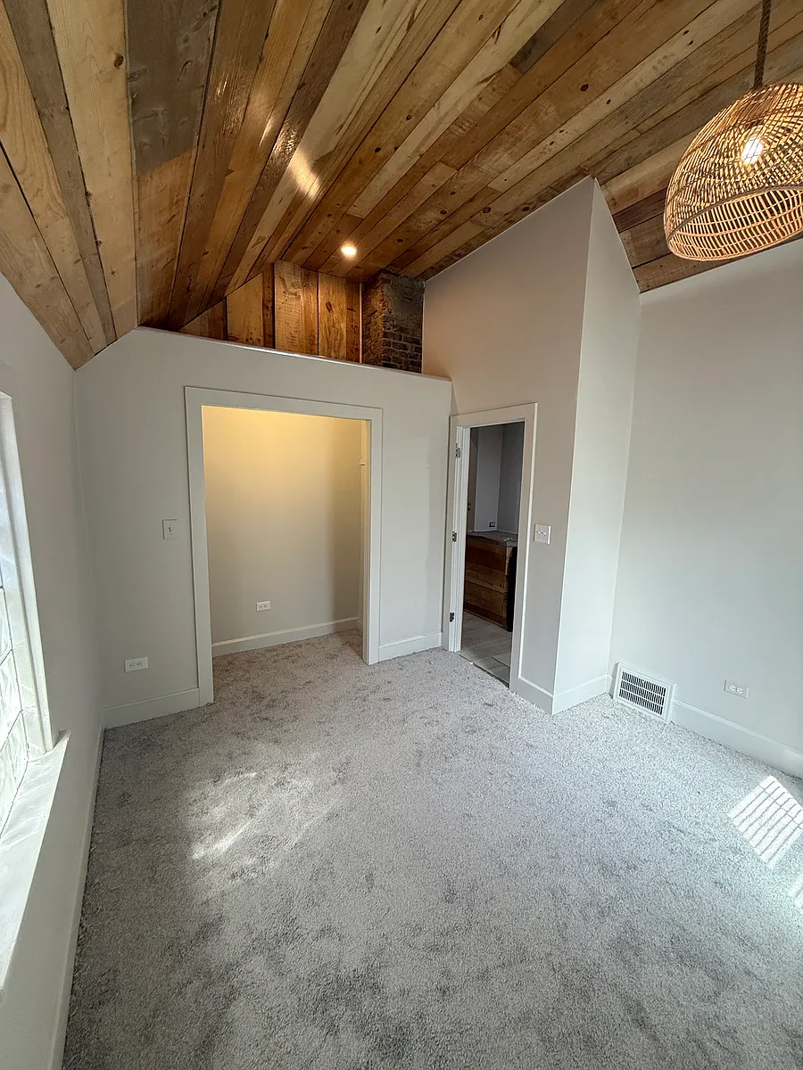 No section 8 Updated single family ranch located between a neighborhood garden and vacant lot It's a fenced in lot with a sliding entry gate to park inside property House has alley in rear of property where u enter gate Concrete counters — photo 2