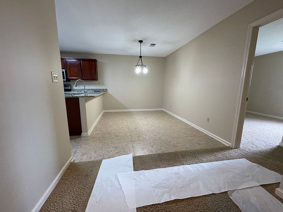 Spacious dining room area, adjacent kitchen