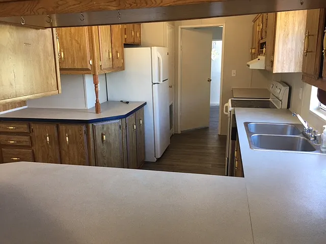 Refrigerator, stove/oven included.