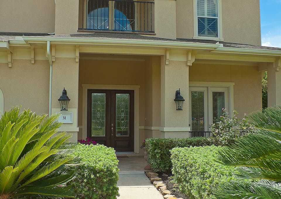 Welcome your friends & family on this beautiful covered front porch with elegantly designed beveled glass double entry doors.