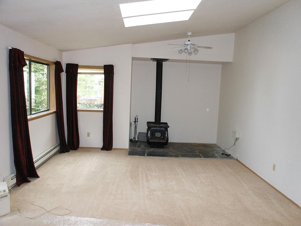 Great Room with new wood stove and skylights
