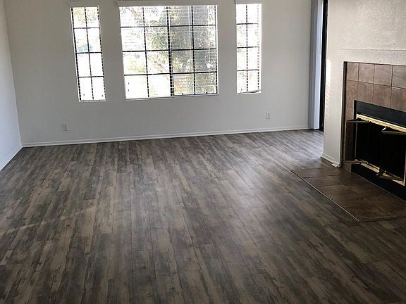 Living Room Has a Wood Burning Fireplace