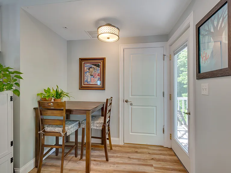 Dinning area leading to back entrance and back deck