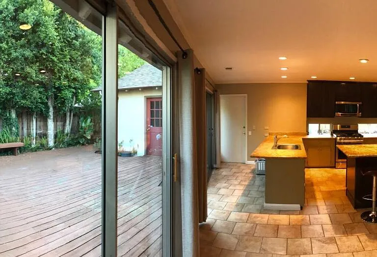 Indoor outdoor setup with direct side yard access.