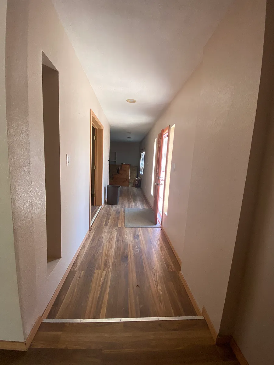 Entry way. Hallway to the right leads to large family room. Hallway to the left leads to bedrooms and second living area. Directly in front of entry door is the study/office. - 14 Valencia Rd