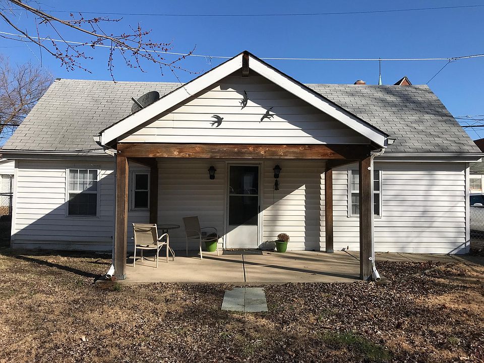 Inviting front porch overlooks the yard