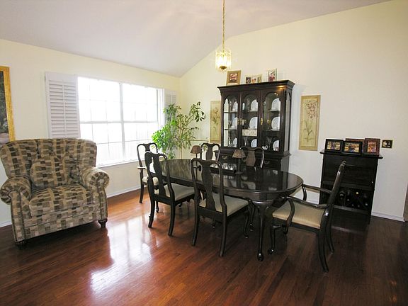 Formal dining with wood floors