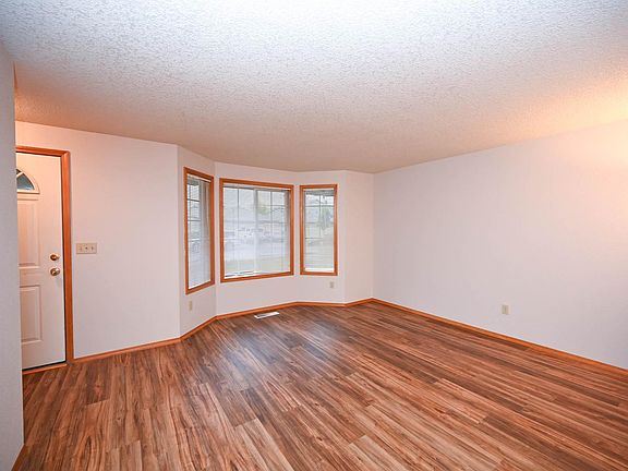 Living room with bay windows