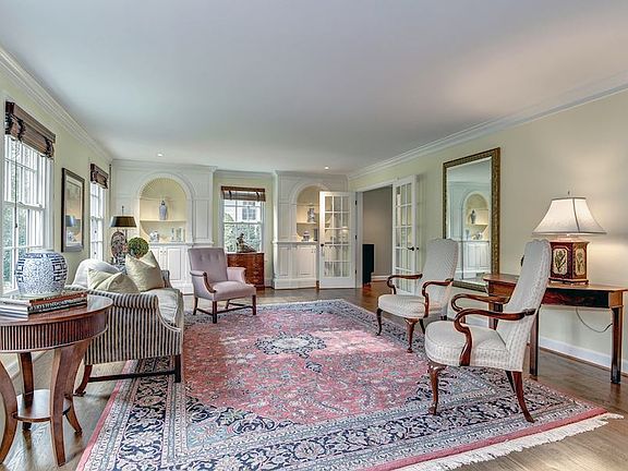 Elegant Formal Living Room opens up to Family Room