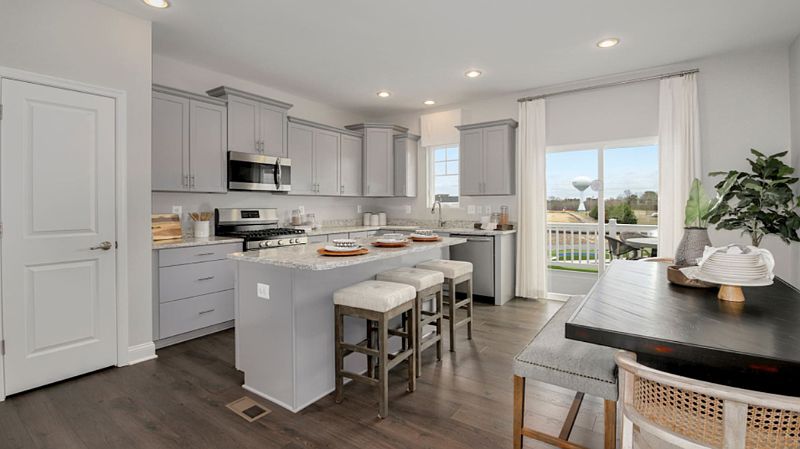 Kitchen and dining are with breakfast island located on the 2nd floor of the unit.
