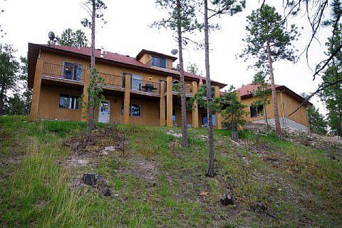 Rear view showing large deck above the walkout