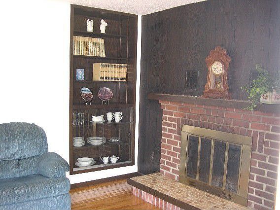Living Room has a fireplace and hardwood floors.