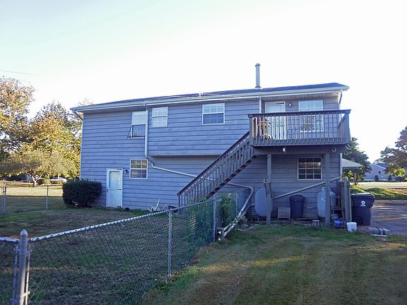 Rear view of the home with the deck