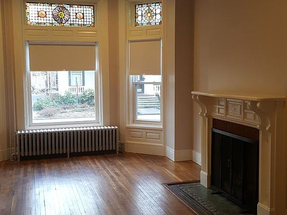 Spacious LR with gas fired fireplace, gorgeous stained glass