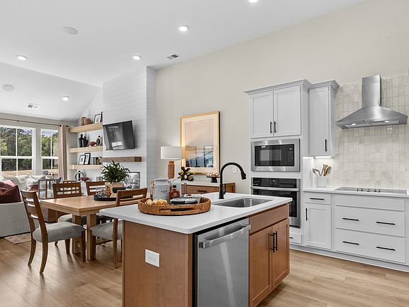 The Summit kitchen offers a large island and open flow for daily living.