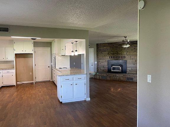 Kitchen and family room, with fireplace.