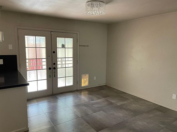 Dining room with french doors to back patio/covered parking