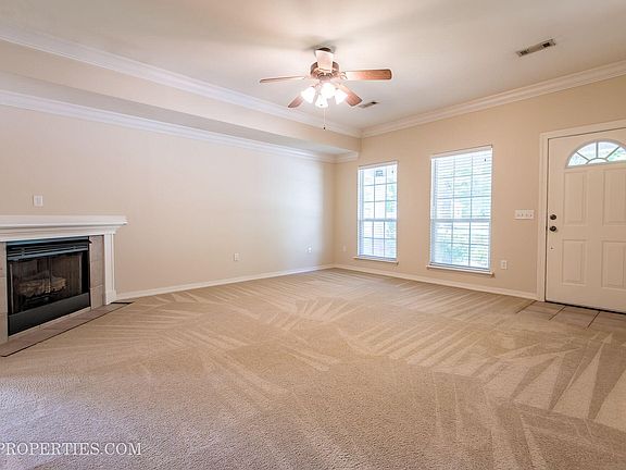 9 ft ceilings with crown molding and gas log fireplace! New LVP wood flooring being installed.