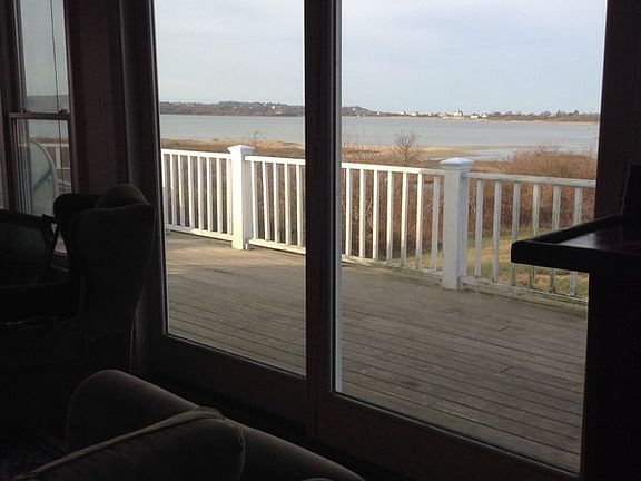 Deck from great room looking left
						:
						All windows and sliders on west wall replaced in 2012