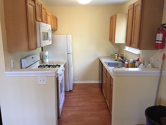 Kitchen - updated refrigerator and dishwasher and newly installed microwave, stove, sink and counter tops.