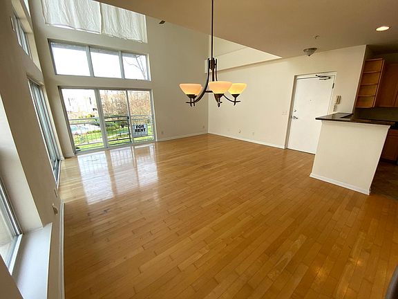 View of entry door, dining room & living room