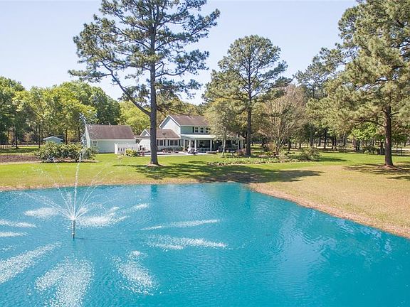 PICTURESQUE BACKYARD WITH POND AND FOUNTAIN AND PLENTY OF SHADE!