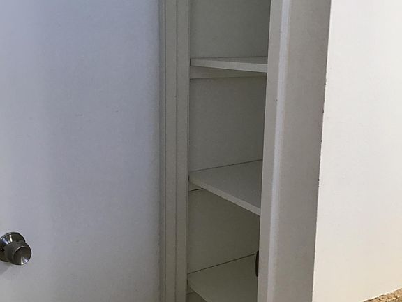 Linen closet in downstairs bathroom