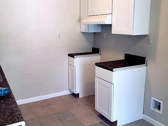 Kitchen - Range and refrigerator area