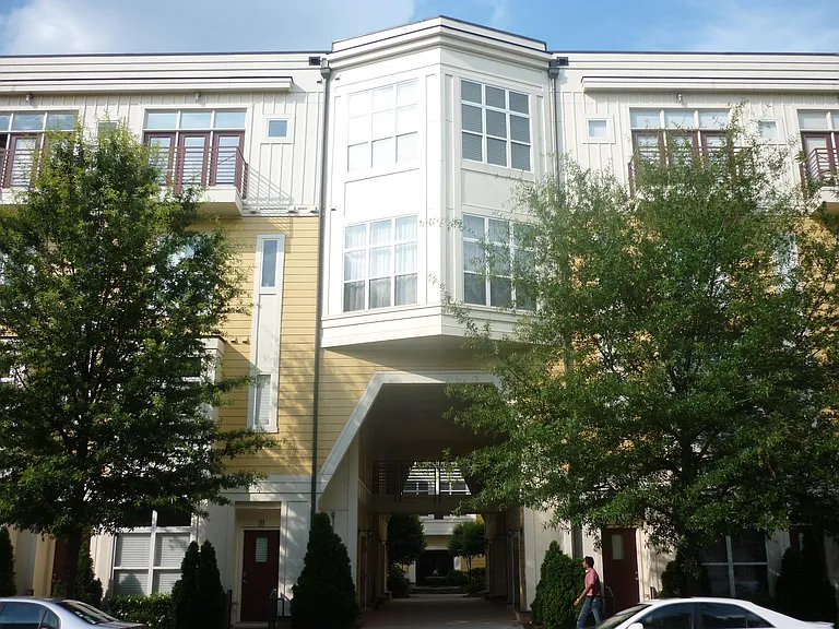Exterior. Unit is on the 3rd floor above the walkway into the courtyard.