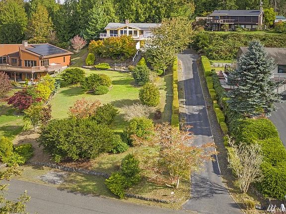 A long driveway leads to the home, providing privacy.  