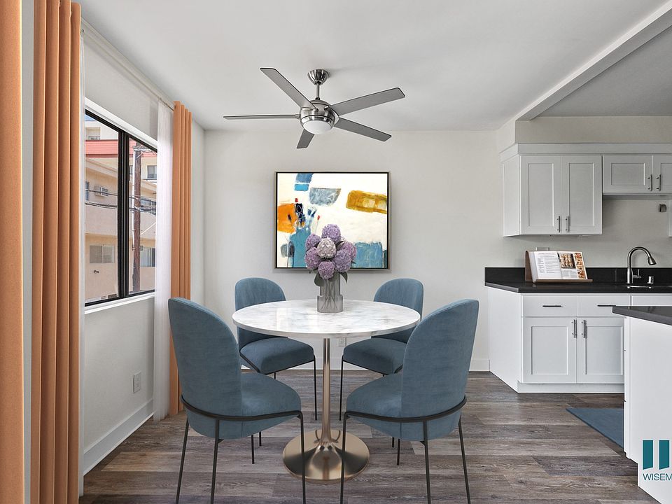Dining Room with Large Windows and Vinyl Flooring