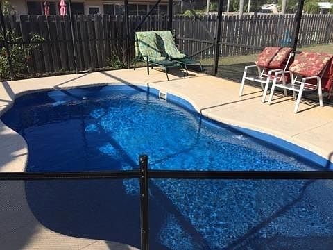 private screened pool area directly adjacent to outdoor dining space. Cool down and relax in our 20 foot freeform, heated, fiberglass pool with a jetted seat at one end and tanning ledge at the other Pool is 3 feet slowly grading to 5 feet