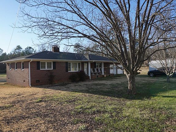 3 BR / 2 BATH - ALL BRICK RANCH HOME ON 1 ACRE LOT WITH 2 CAR ATTACHED GARAGE/ 1 CAR DETACHED GARAGE / DETACHED WORKSHOP AND/ OR STORAGE BUILDING / CENTRAL HEAT AND AIR / ~1450 SQ FT
